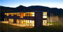 FlatPak custom home in Aspen at night.