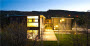 FlatPak custom home in Aspen at night from rear.